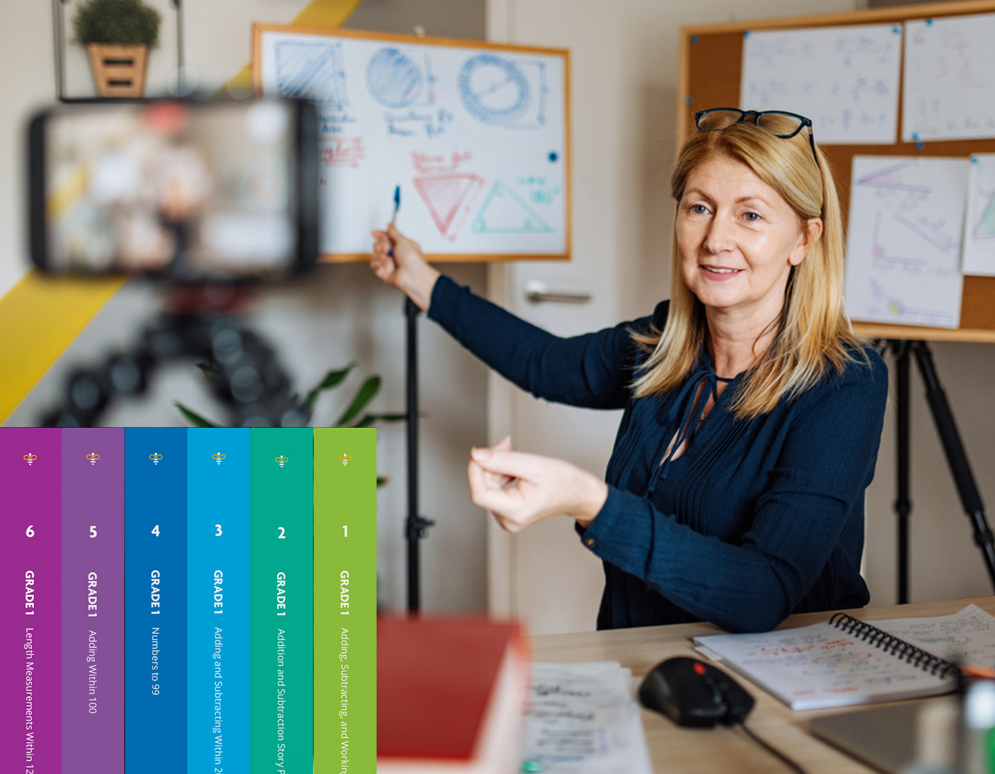 A professional woman with olive skin is presenting a business strategy on a whiteboard while being recorded by a smartphone camera, in a colorful and dynamic office environment.